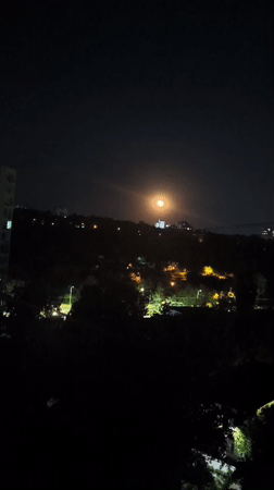 Chișinău at night: apartment blocks and a full moon