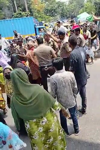 Police gather with crowd on Dhaka street