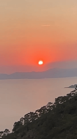 Sunset documented over Fethiye coastline during evening hours