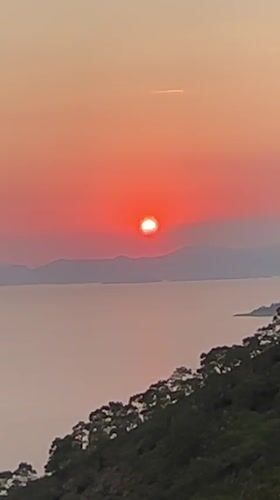 Sunset documented over Fethiye coastline during evening hours