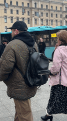 Street musicians perform in Saint Petersburg square amid pigeons