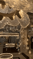 Dubai luxury décor showroom displays chandeliers, fountains, figurines