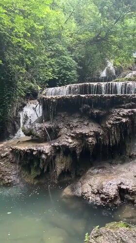 Krushuna Waterfalls tiered cascades through Bulgarian forest landscape