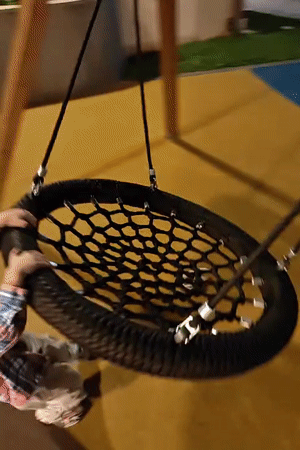 Child plays on Mumbai playground with balance bike
