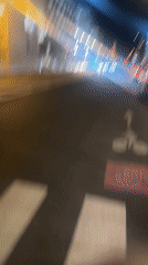 Pedestrian crossing filmed at night in Paris street scene