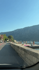 Cruising the coastal road through Dobrota on a sunny afternoon