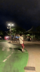 Night rollerblading on a green urban path in Tel Aviv