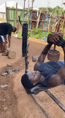Men use makeshift outdoor gym equipment in Akwanga, Nigeria