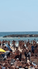 Tel Aviv residents enjoy sunny beach day amid urban activity