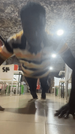 Person exercises indoors in Obosi, Nigeria
