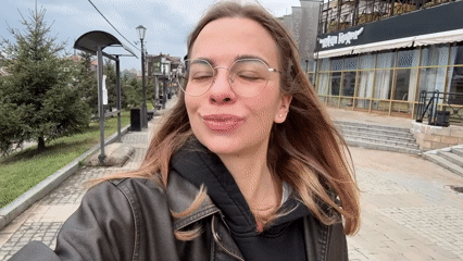 Woman films herself on pedestrian street in Irkutsk