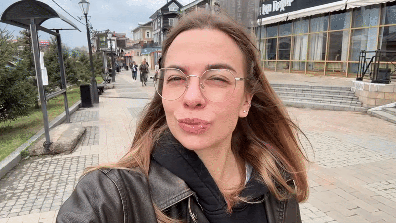 Woman films herself on pedestrian street in Irkutsk