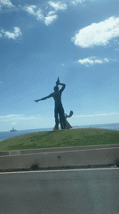 Public sculptures documented on Las Palmas hillside with pedestrian activity