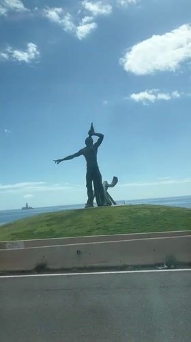 Public sculptures documented on Las Palmas hillside with pedestrian activity