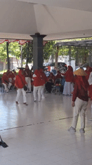Coordinated cultural dance performance at outdoor pavilion in Surabaya