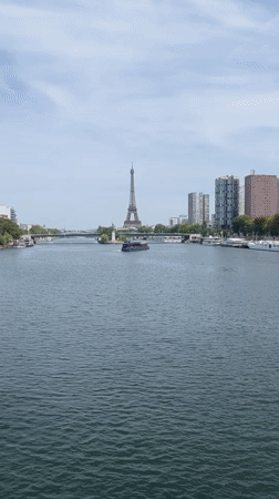 Tour boat cruises the Seine with the Eiffel Tower in view