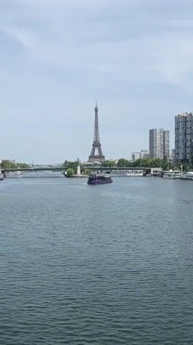 Tour boat cruises the Seine with the Eiffel Tower in view