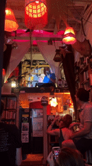 Intimate live music set in a dimly lit New York bookstore venue