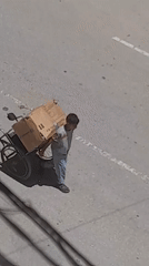Street activity across Khan Yunis on a July morning