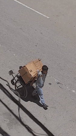 Street activity across Khan Yunis on a July morning