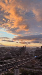 Sunset cityscape documented in Khimki, Russia featuring illuminated skyscraper