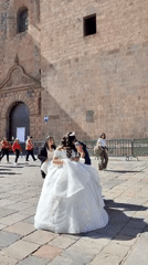 Formal dress photoshoot captures moment in historic Cuzco plaza