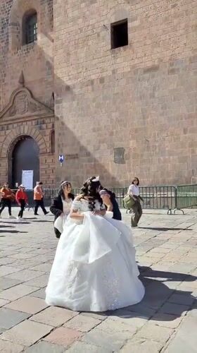 Formal dress photoshoot captures moment in historic Cuzco plaza