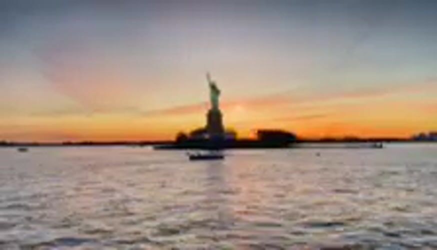 Statue of Liberty sunset view from Bayonne waters