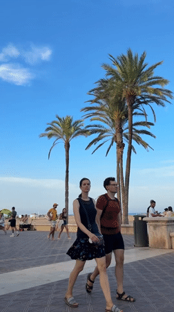 Afternoon activity along Valencia's Malvarrosa Beach promenade