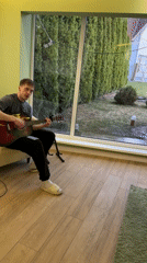 Musician performs with tulips present in Kursk home