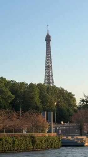Eiffel Tower and crescent moon over Paris on a clear evening
