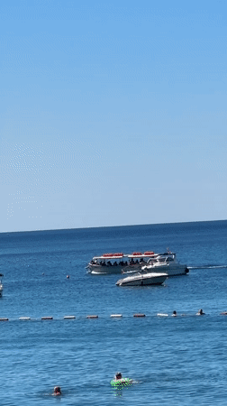 Bečići beach scene with coastal views and a branded tag