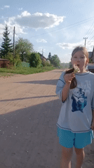 Mother, daughter spend spring afternoon exploring nature, dandelions, ducks
