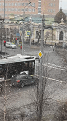 Light snowfall blankets city streets and residential areas