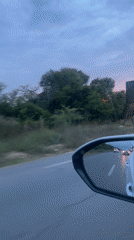 Evening traffic captured during sunset drive through Ghmate, Morocco