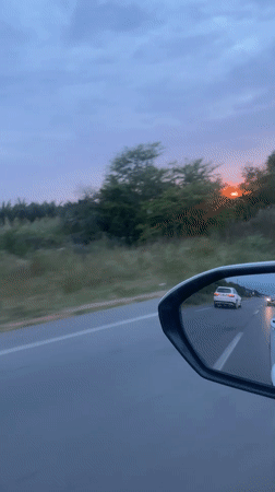 Evening traffic captured during sunset drive through Ghmate, Morocco
