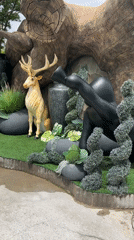 Garden resort with decorative statues and landscaping documented morning