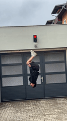 Person performs street acrobatics in German Alpine town