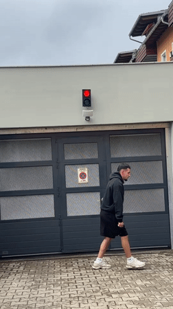 Person performs street acrobatics in German Alpine town