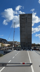 Copenhagen drawbridge marked 'EARL' caught mid-lift