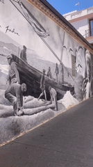 Maritime mural featuring fishermen documented in Badalona, Spain