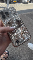 Woman displays jeweled iPhone case on Netanya street