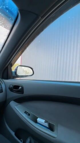 Woman visits car wash in Khanskaya, Russia