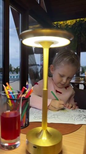 Family dining moment captured at plant-filled Kamyshin restaurant