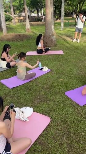 Early morning yoga and exercise in a Chiang Mai park