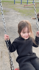 Mother and daughter enjoy afternoon playground visit in Russia