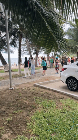 Morning exercise group gathers at beachside park in Vietnam