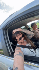 Woman takes selfies in car in Votkinsk, Russia