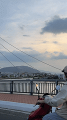 Bridge view captured in Nha Trang showing waterfront cityscape