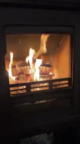 Cozy indoor evening documented in Deal with fireplace, selfie